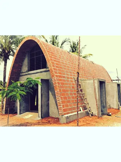 The form of this farmhouse is inspired by the simple, powerful geometry of a brick vault. Currently under construction, this project uses locally sourced bricks to create a unique, climate-friendly structure that feels both ancient and modern.