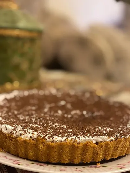 My classic Banoffee Pie. It has a buttery biscuit base, a layer of rich toffee, fresh bananas, and is topped with whipped cream and chocolate shavings.