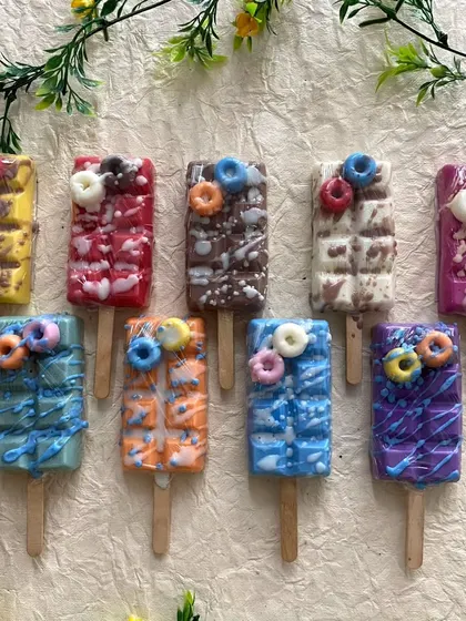 My new popsicle soaps have been a huge hit. This photo shows the full range of colorful designs, each topped with tiny donut soaps. They look good enough to eat.