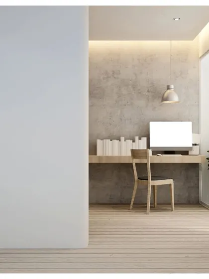 A minimalist study nook. This simple setup with a floating wooden desk and a single chair is perfect for small spaces, proving that you don't need a large room for a functional workspace.