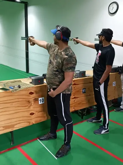 A group practicing their pistol shooting skills. I provide all the necessary safety gear, including ear protection, for a complete and professional experience.