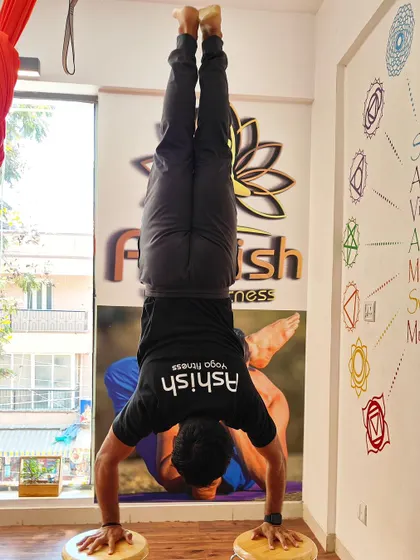 Using balancing discs instead of the floor adds a significant challenge to this handstand practice.