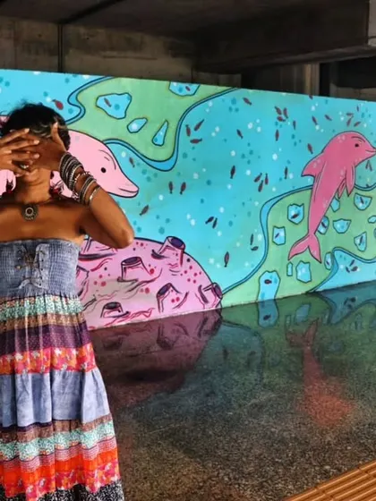 A playful shot of me in front of my surreal underwater-themed mural at the metro station. I hoped to bring out the curious child in every commuter.