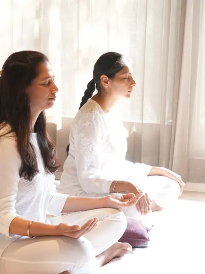 Two students in a state of meditative calm. You can sense the transformative energy we cultivate in our workshops.