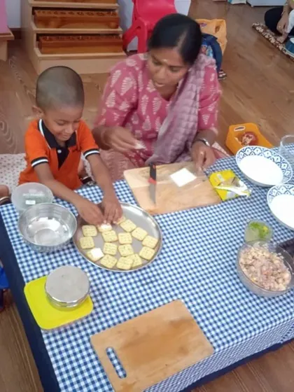 A mother and son preparing snacks together. These collaborative activities are a fantastic way for parents to engage in their child's learning in a fun, hands-on way.