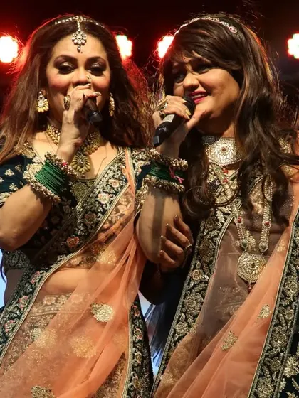A candid moment of us singing together. Our natural connection on stage is something our audience always appreciates.
