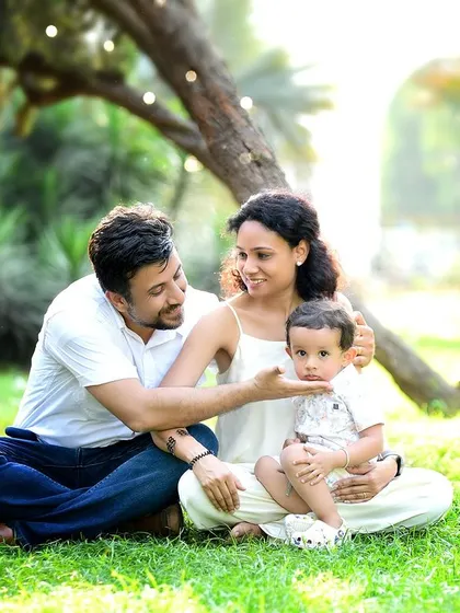 A beautiful outdoor family session in a sun-drenched park. The natural setting provides a relaxed and authentic backdrop for capturing your family's bond.