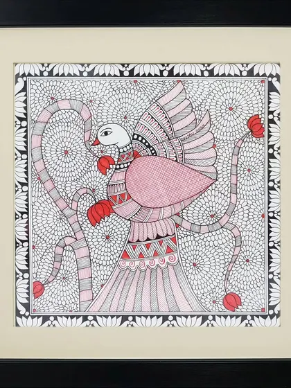A graceful bird with large wings is the subject of this Madhubani painting by Rinki Joshi. The background is filled with a dense floral pattern, showcasing the artist's skill in detailed line work.