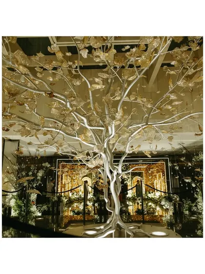 A 'Gold & Glam' mood board featuring a stunning wishing tree. This visual guide helps clients see how different elements will come together to create a cohesive and luxurious theme.