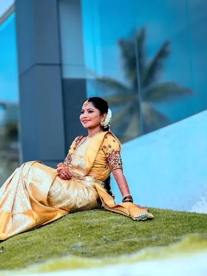 Apoorva looking serene and beautiful for her muhurtham. The outdoor lighting highlights her flawless HD makeup, which is designed to look natural and radiant.