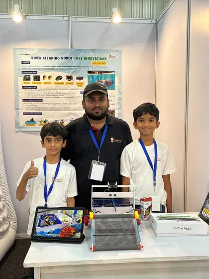 Our mentor stands with the student creators of the river cleaning robot. We are there for every step of the process, from the initial idea to the final presentation.