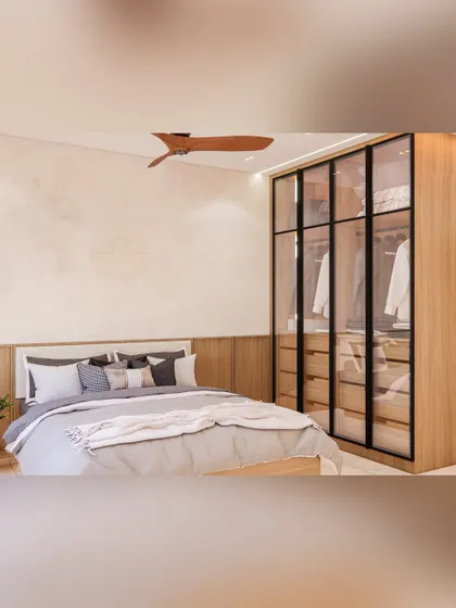 A bedroom at Prestige Waterford designed with intent. This space features a modern glass-door wardrobe, a neutral color palette, and warm wood tones, creating a beautifully balanced and functional room.