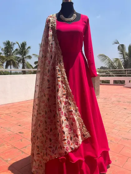 The full view of the pink Anarkali, showing its layered hem.