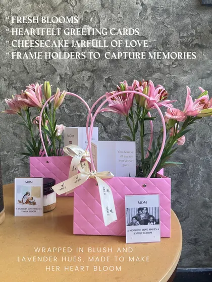 Our Mother's Day edit, featuring fresh blooms, a cheesecake jar, and heartfelt greeting cards, all wrapped in lovely blush pink and lavender hues to make her heart bloom.