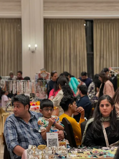 Even with seating areas, the aisles remain busy. This image captures the density of the crowd and the engaged atmosphere of the event.