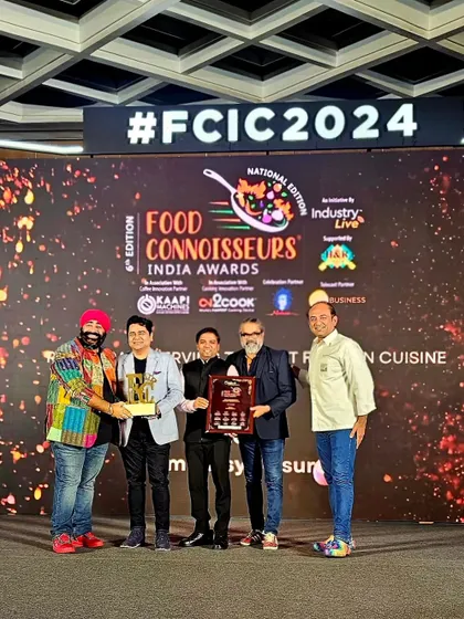 Another shot of our team receiving an award on stage.