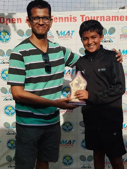 Arhan Jain, our Open Singles Finalist, with his award. It's great to see our junior players stepping up and competing successfully in the open category against senior players.