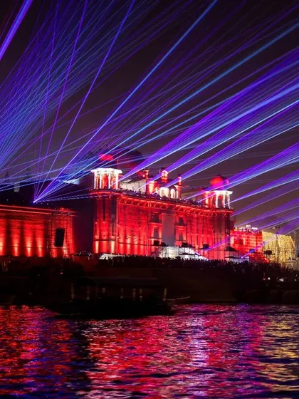Dev Deepawali in Varanasi is a visual spectacle. This shot captures the grand laser show over the historic Ramnagar Fort, reflecting vibrant colors onto the sacred Ganga river.