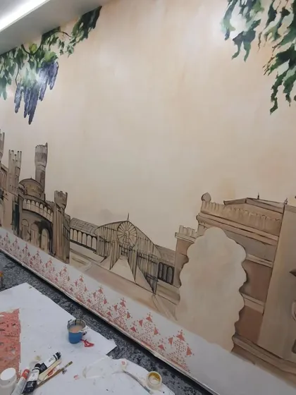 The Bengaluru mural in an earlier stage, with the initial layers of color and outlines being filled in.
