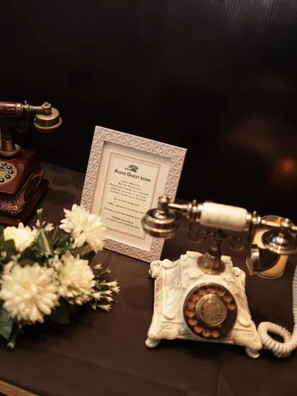An audio guest book station with vintage telephones, where guests could leave recorded messages for the birthday girl.