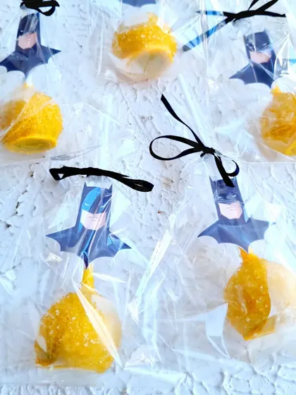 Batman-themed cakepops, individually wrapped and perfect for party favors.