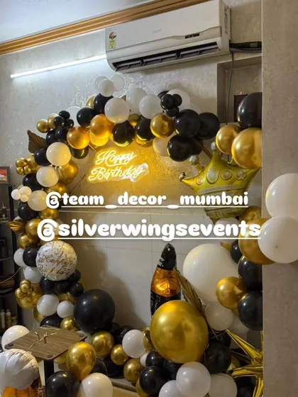 Another shot of the compact and chic black and gold birthday decor, perfect for an apartment celebration in Mumbai.
