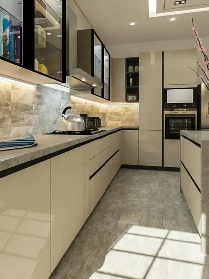 This view showcases the L-shaped layout of the modular kitchen, designed for an efficient workflow. The seamless countertop, marble-patterned backsplash, and built-in oven contribute to the kitchen's clean, modern look.