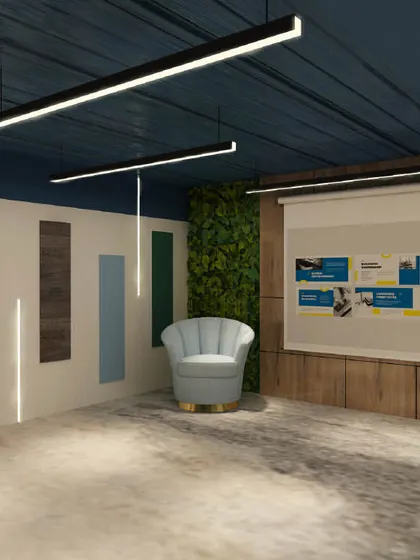A presentation area with a large screen and a comfortable armchair. The wall features a vertical garden and colorful panels, adding visual interest to the space.