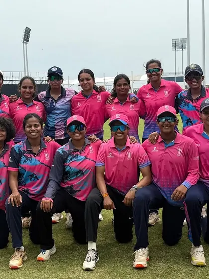 The full squad posing for a team photo on the ground in Pondicherry. A picture of a confident and united team on the road.