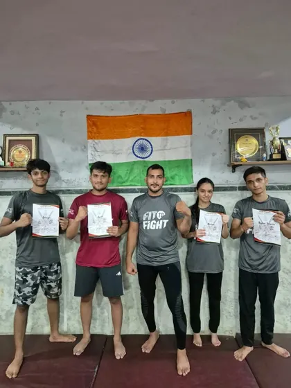 A group of our members proudly holding their camp participation certificates.