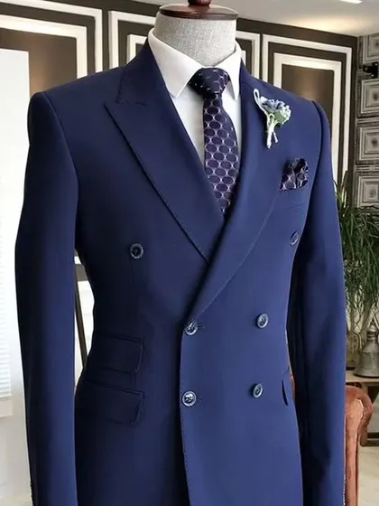 A classic navy blue double-breasted suit. This is a staple of men's formal wear, and I make sure mine are tailored to perfection.
