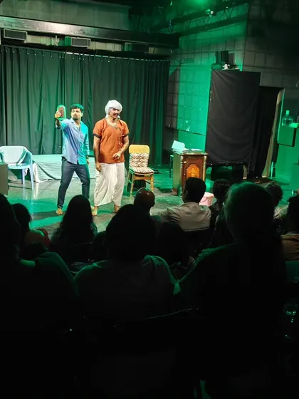 A scene from a student play with dramatic green lighting, showing how our LED lights can create a specific mood.