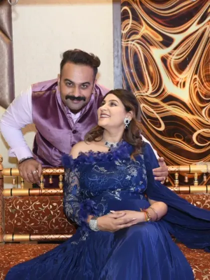 A candid, loving glance between the couple during their baby shower photoshoot. These are the unscripted moments that truly tell your story.