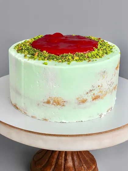 My Raspberry Pistachio Naked Cake is a symphony of flavors. I pair a soft pistachio sponge with a tangy fresh raspberry compote and a creamy pistachio white chocolate ganache. It's a sophisticated combination for those who appreciate a balance of nutty and tart.