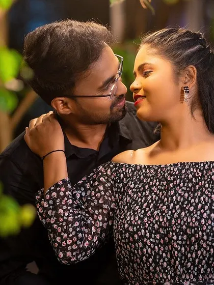 A romantic close-up capturing the deep connection between the couple, enhanced by the warm, soft lighting.