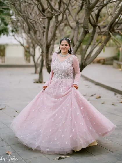 Muskaan joyfully twirling in her princess-like engagement gown.