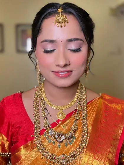 A close-up of the soft and elegant eye makeup for this South Indian bridal look. The subtle shimmer and defined lash line create a look that is both traditional and modern.