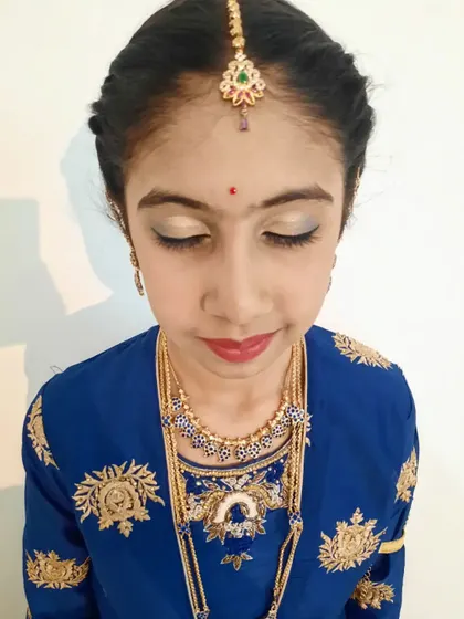 Another makeup close-up from a puberty ceremony. The focus is on clean, simple makeup with a light shimmer on the eyes to make her feel special.