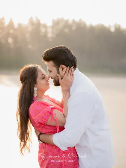 An intimate close-up of the couple on a beach at sunset, capturing the romance of the golden hour during their pre-wedding session.