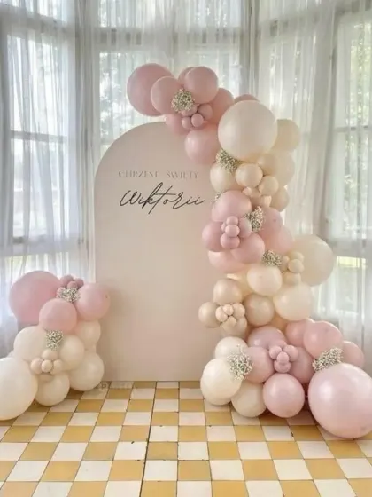 A simple and elegant balloon arrangement in pastel pink and cream. This setup against a clean white backdrop is perfect for a christening, bridal shower, or minimalist birthday.