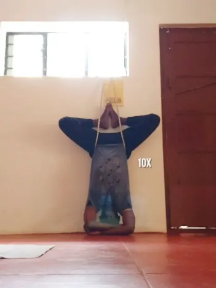 Another variation of a supported inversion, this time with legs in Baddha Konasana. This is therapy for the spine, taking gravitational pressure off the disks and creating space between the vertebrae.