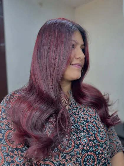 A side view of the cherry blossom red, showing how the color complements her skin tone and personal style.