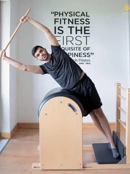 Breaking stereotypes one pose at a time. This client is using the Ladder Barrel to improve his side body strength and flexibility, proving Pilates is for every body.
