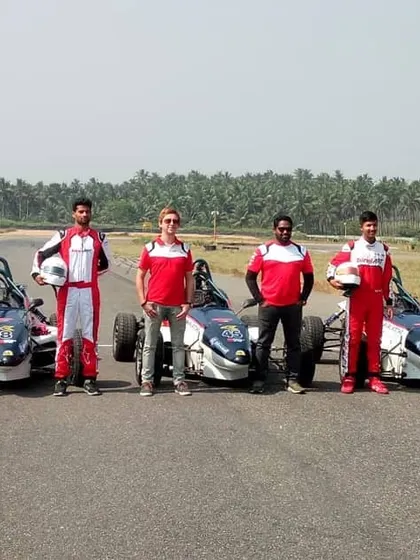 Another group shot of our drivers and Formula LGB cars, showcasing the scale of our training program.