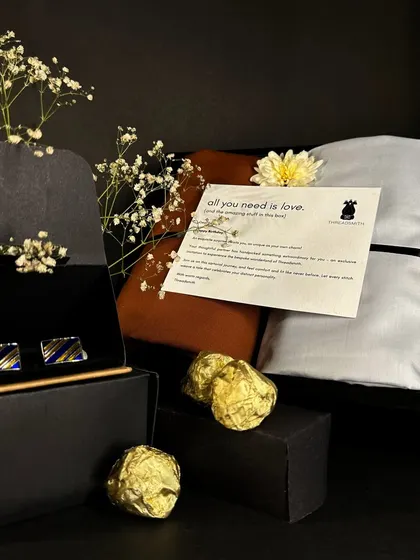Our gift sets are a celebration of luxury and indulgence. This one includes fabric for a shirt and trouser, cufflinks, and some sweet treats to make it extra special.