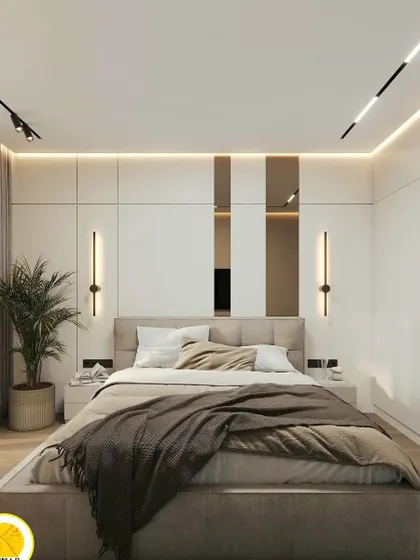A full view of the bedroom, showcasing the floor-to-ceiling wardrobes and the minimalist design.