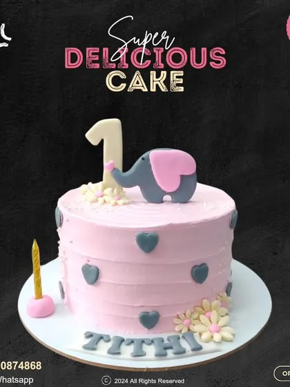 A sweet and simple first birthday cake. This pink design is decorated with grey hearts, delicate flowers, and a cute elephant topper, personalized with the baby's name.