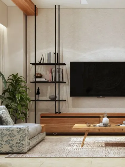 This living room showcases eco-chic design with its use of natural wood, a block-printed armchair, and plenty of indoor plants, creating a calm and earthy atmosphere.