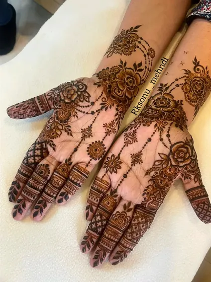 This elegant design is all about "less is more." Featuring delicate floral jewelry patterns and intricate net designs, it's a favorite among bridesmaids and guests who want a sophisticated look.