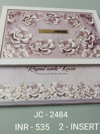 This premium invitation features a beautiful frame filled with three-dimensional lavender roses, giving it a soft and romantic feel. The gold nameplate in the center can be customized with your initials for a personal touch.